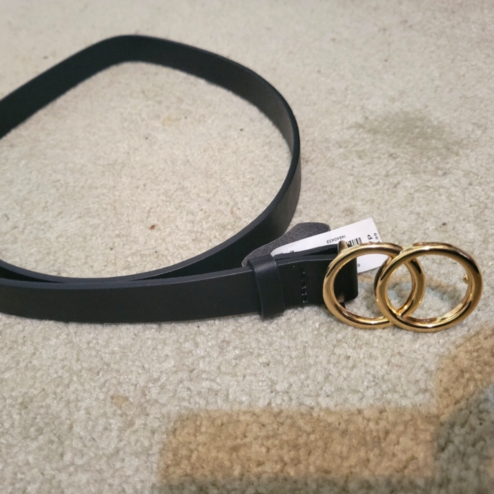 Unused black and gold belt